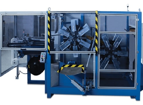 Solid wall pipe coiling and strapping machine