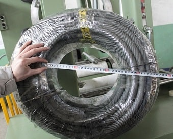 Corrugated hose coil wrapper packing reels